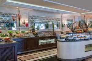 a restaurant with a lot of food on display at Elite World Istanbul Florya in Istanbul
