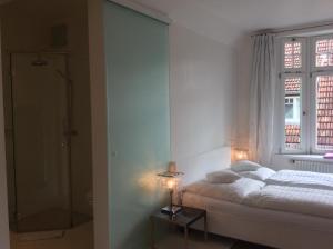 Postel nebo postele na pokoji v ubytování Hotel Heidelberg Astoria