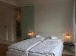 Postel nebo postele na pokoji v ubytování Hotel Heidelberg Astoria