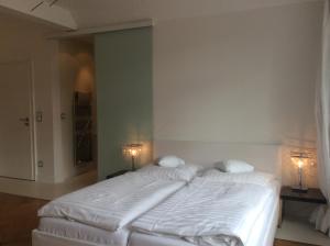 Postel nebo postele na pokoji v ubytování Hotel Heidelberg Astoria