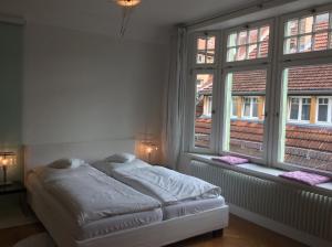 Postel nebo postele na pokoji v ubytování Hotel Heidelberg Astoria