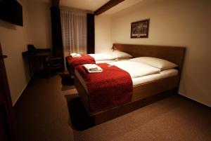 Posteľ alebo postele v izbe v ubytovaní Apartments & Suites Žlutá Hruška