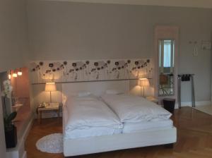Postel nebo postele na pokoji v ubytování Hotel Heidelberg Astoria
