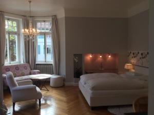 Postel nebo postele na pokoji v ubytování Hotel Heidelberg Astoria