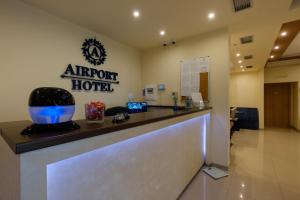 an airport hotel reception counter in a lobby at Airport Hotel Garni in Belgrade