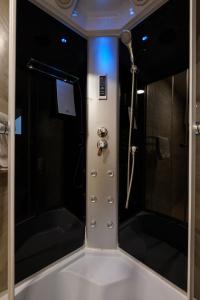 a bathroom with a shower and a shower at Airport Hotel Garni in Belgrade