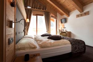 Postel nebo postele na pokoji v ubytování Hotel Vedig