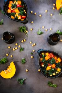 two bowls of food on a table with vegetables and fruit at Malmaison London in London
