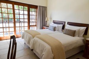 Katil atau katil-katil dalam bilik di Dolliwarie Guesthouse