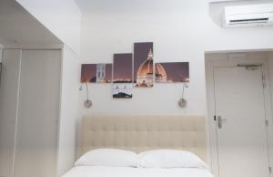 A bed or beds in a room at Le Tre Lune Suites