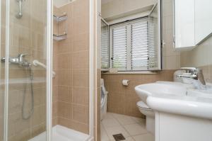 Kúpeľňa v ubytovaní Apartment Veve