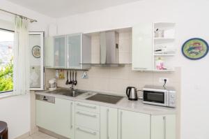 Kuchyňa alebo kuchynka v ubytovaní Apartment Veve