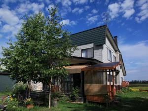 a house with a tree in front of it at Akane-yado in Nakafurano +88 photos