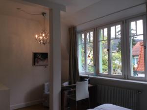 Postel nebo postele na pokoji v ubytování Hotel Heidelberg Astoria