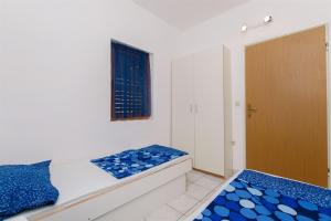 a bedroom with a bed and a window at Apartment Renata in Sutivan +16 photos