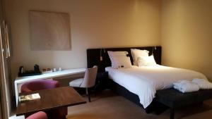 Postel nebo postele na pokoji v ubytování B&B Huize Briers