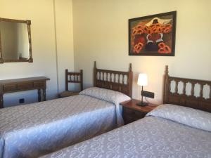 Posteľ alebo postele v izbe v ubytovaní Hostal Argentino