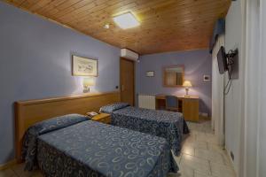 Postel nebo postele na pokoji v ubytování Terme Di Monte Valenza