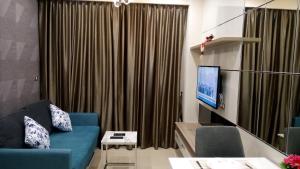 TV a/nebo společenská místnost v ubytování Dusit Grand Condo View