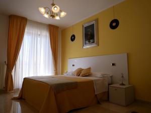 Postel nebo postele na pokoji v ubytování Donna Nicla B&B