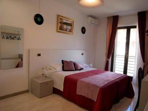 Postel nebo postele na pokoji v ubytování Donna Nicla B&B