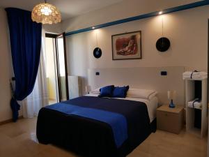 Postel nebo postele na pokoji v ubytování Donna Nicla B&B
