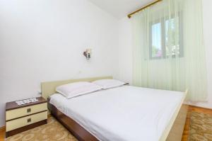 Postel nebo postele na pokoji v ubytování Apartments Jerka