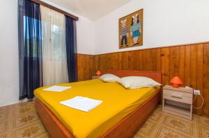 Postel nebo postele na pokoji v ubytování Apartment Ana