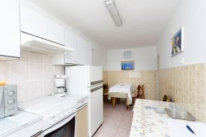 Kuchyň nebo kuchyňský kout v ubytování House Laura + 6 fotografií