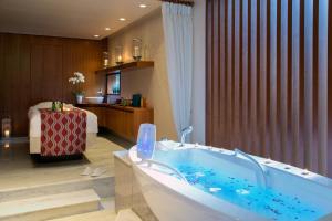 a bathroom with a tub in a hotel room at Casale Panayiotis in Kalopanayiotis