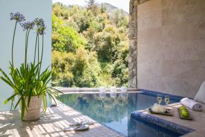 a swimming pool with a view of a mountain at Casale Panayiotis in Kalopanayiotis