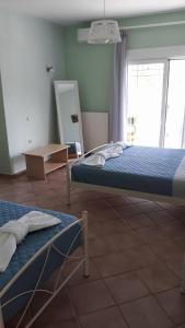 Postel nebo postele na pokoji v ubytování Olympic View Guesthouse