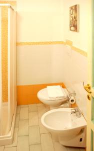 a bathroom with a toilet and a sink at Midiè B&B Savelletri in Savelletri di Fasano