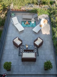 an overhead view of a patio with a pool and furniture at Sweet Tuscany Appartamento Gold in Arezzo