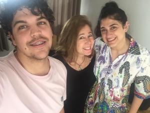 a man and two women posing for a picture at Pousada Family Consulado Americano in São Paulo