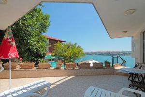 a patio with a view of the water at Villas Sozopol in Sozopol
