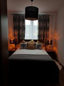 Łóżko lub łóżka w pokoju w obiekcie Apartament Krupówki Centrum