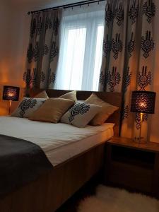 Łóżko lub łóżka w pokoju w obiekcie Apartament Krupówki Centrum