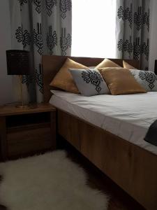 Łóżko lub łóżka w pokoju w obiekcie Apartament Krupówki Centrum