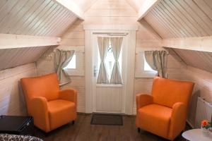 a room with two chairs and a window at Glamping & Camping in Vestmannaeyjar