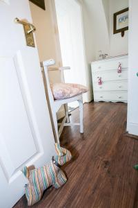 a room with a chair and a sock on the floor at Southford House (Room Only) in Dartmouth