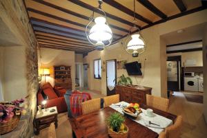 a living room with a dining table and a living room at King David Suite in Toledo