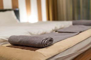Giường trong phòng chung tại Cityhome Downtown Suites & Spa +25 ảnh