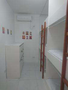 Cama ou camas em um quarto em Galinha d'Angola