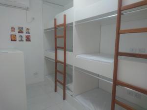 Cama ou camas em um quarto em Galinha d'Angola