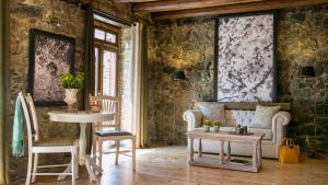 a room with two chairs and a table at Casale Panayiotis in Kalopanayiotis