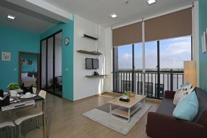 a living room with a couch and a table at Eco Garden Residences in Phnom Penh