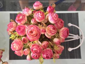 a bouquet of pink flowers sitting on a table at Sky's at Prime Residences -Tagaytay in Tagaytay +34 photos