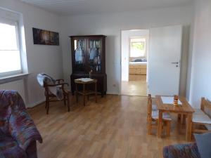 a living room with a couch and a table at Die Gefährten in Oberhausen +42 photos