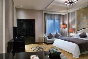Postel nebo postele na pokoji v ubytování Ramada Plaza Tianlu Hotel + 28 fotografií
